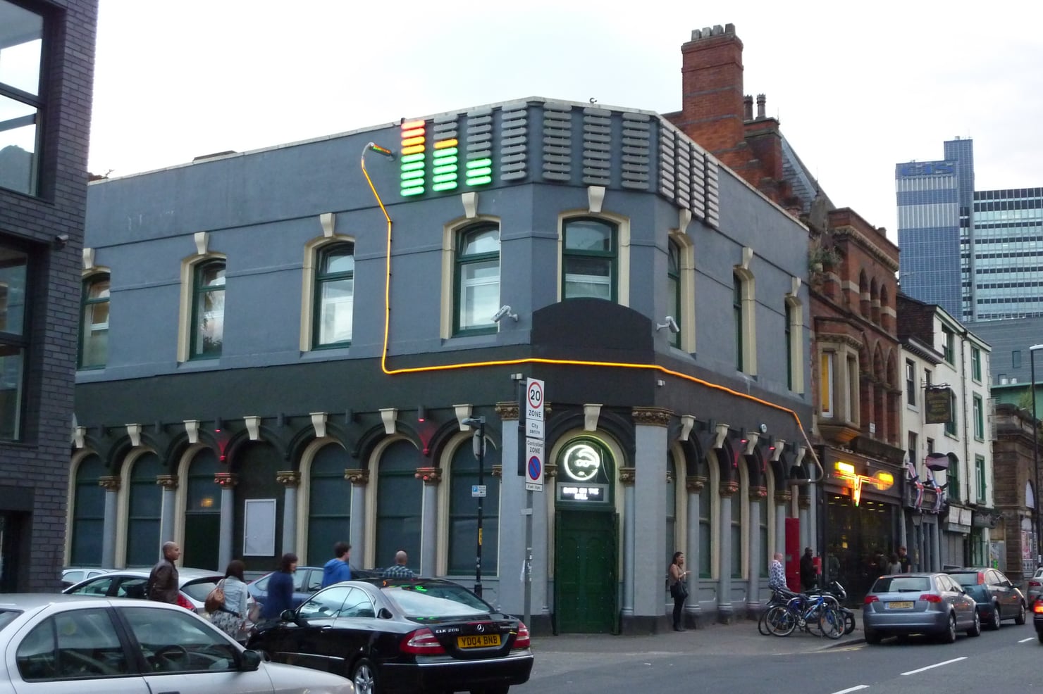 Band on the Wall in Manchester, its neon equaliser sign lit above the corner entrance
