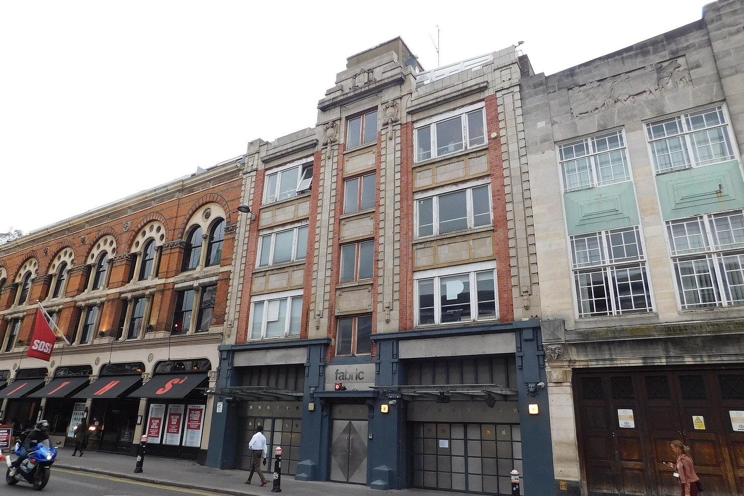 The exterior of fabric on Charterhouse Street in Farringdon, the club's steel doors under a brick and stone facade next to Smiths of Smithfield