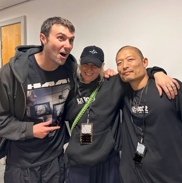 Fred again.. backstage with members of the USB002 touring crew, USB002 lanyards around their necks