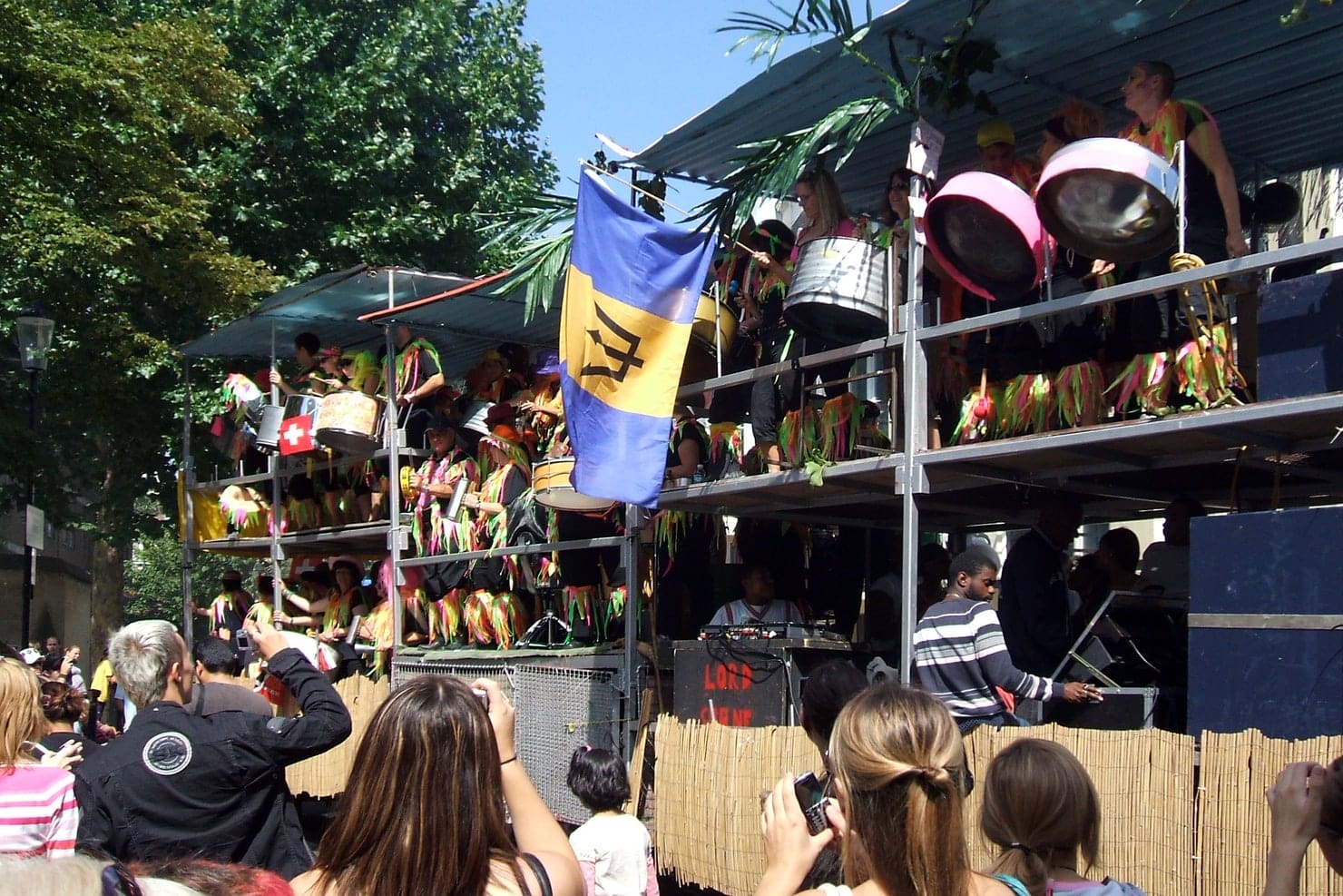 A steel band truck surrounded by crowds at Notting Hill Carnival